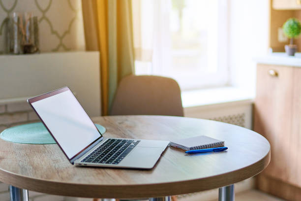 istock Open laptop with white blank display on table at workspace. Computer mockup for online website advertising 2174174602