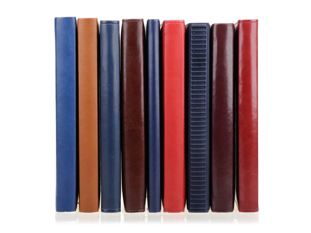 istock Stack of diaries or books with colorful covers on white background 2174175707