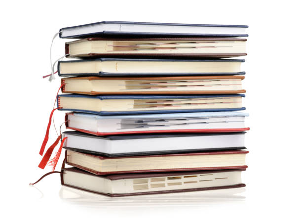 istock Stack of diaries or books with colorful covers on white background 2174175728