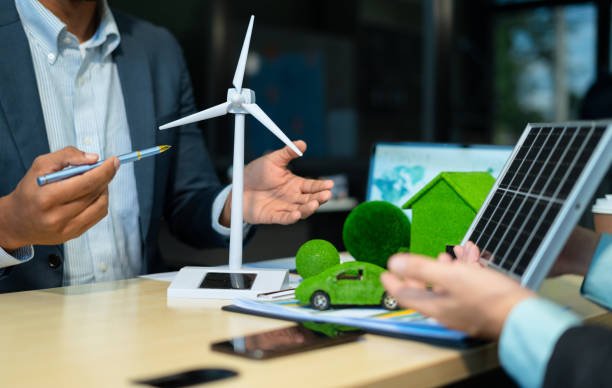 istock Holding a light bulb against nature on green leaf with energy source icon for renewable and sustainable development, ecology concept. 2174177122