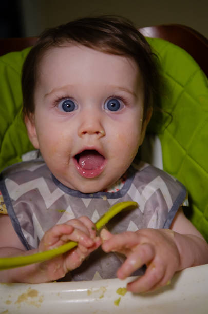 istock Baby Girl Eating 2174183567