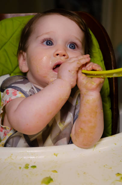 istock Baby Girl Eating 2174183589