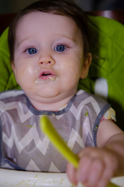 istock Baby Girl Eating 2174183590