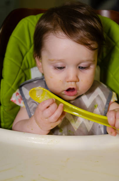 istock Baby Girl Eating 2174183595