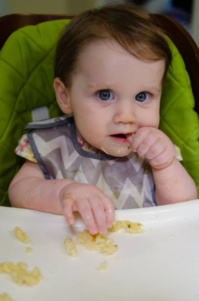 istock Baby Girl Eating 2174183613