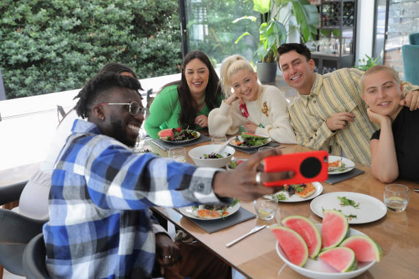 istock Friends taking selfie at lunch 2174186443