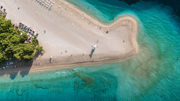 istock Exploring Brac Island's stunning turquoise waters and sandy beaches under bright sunlight 2174186918