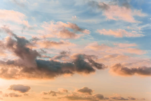 istock Fairy sunset sky with fluffy clouds. Sunset sky natural background. Dramatic Sky. Sunset In Yellow, Orange, Pink Colors. Feeling of dream or freedom. Copy space 2174187065