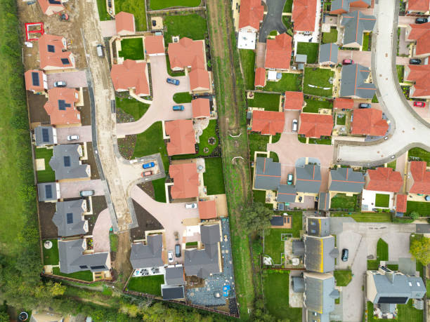 istock Drone top down view of recently completed bungalows seen on a large housing development site Cambridgeshire, UK. 2174188120
