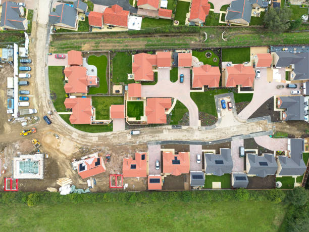 istock Drone top down view of recently completed bungalows seen on a large housing development site Cambridgeshire, UK. 2174188125