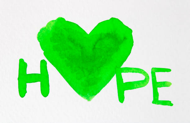Word hope expressed with a big green heart