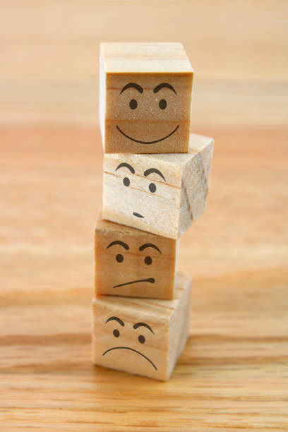 istock Wooden cubes with different facial expressions 2174190315