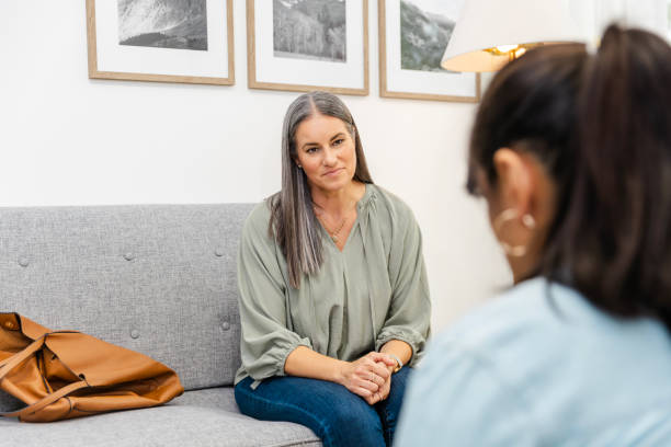 istock Mature female listens intently to her unrecognizable therapist 2174191921