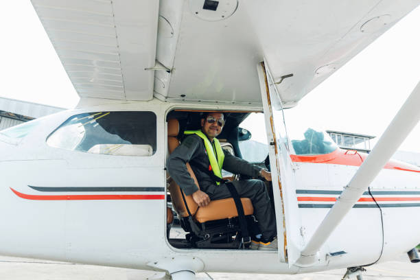 San Diego, United States of America - 26 February, 2014: A rear view of a cessna pilot ready for landing. A small airplane with leather seats, with a passenger compartment and small control panel in the cockpit.