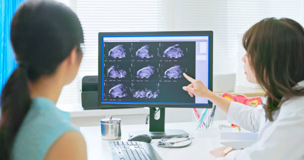 doctor explain woman Uterus ultrasound medical consultation - close up asian female doctor is explaining the situation to woman after Uterus ultrasound Endometriosis stock pictures, royalty-free photos & images