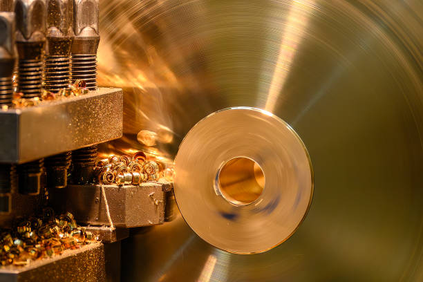 istock The lathe machine finish cut the brass material parts with continue chips. 2174193886