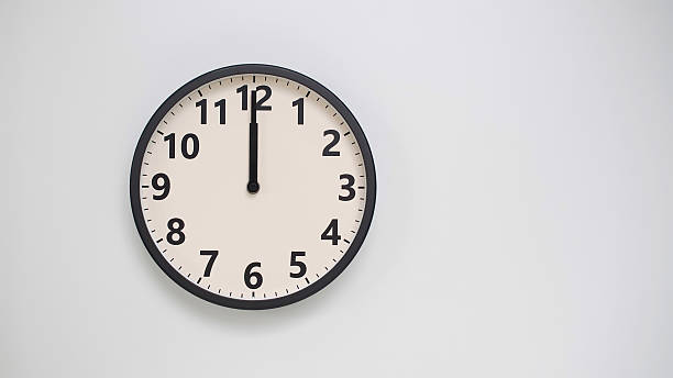 istock Classic Black-Edged Clock on White Background at 12.00 or 0.00 or 24.00 - Perfect for Time Management and Text Space 2174194204