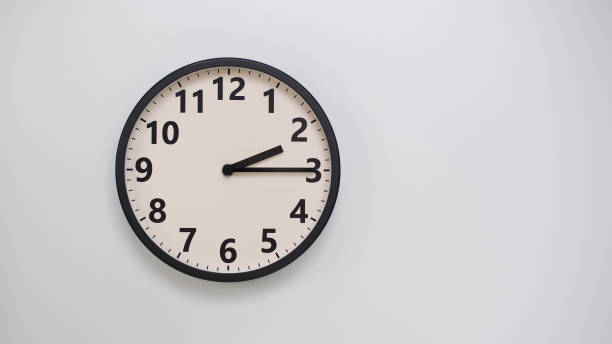 istock Classic Black-Edged Clock on White Background at 02.15 or 14.15 - Perfect for Time Management and Text Space 2174195612