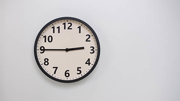 Classic Black-Edged Clock on White Background at 02.45 or 14.45 - Perfect for Time Management and Text Space