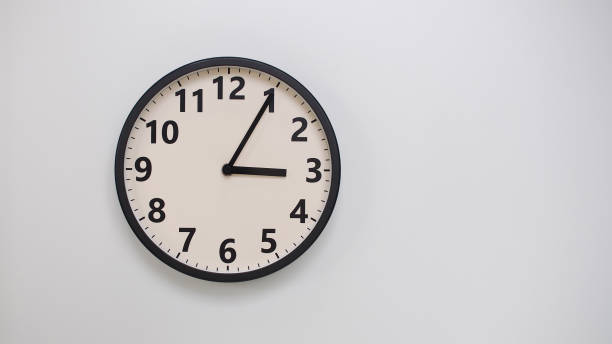 istock Classic Black-Edged Clock on White Background at 15.05 or 03.05 - Perfect for Time Management and Text Space 2174195621