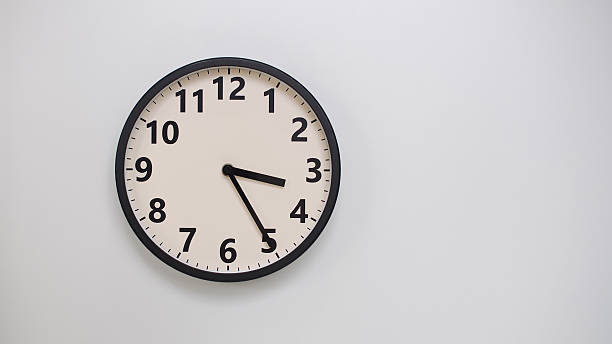 istock Classic Black-Edged Clock on White Background at 15.25 or 03.25 - Perfect for Time Management and Text Space 2174195624