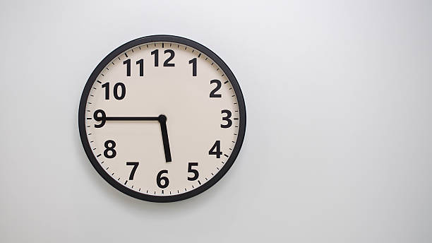 istock Classic Black-Edged Clock on White Background at 17.45 or 05.45 - Perfect for Time Management and Text Space 2174195805