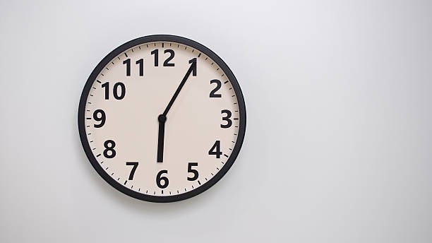 istock Classic Black-Edged Clock on White Background at 18.05 or 06.05 - Perfect for Time Management and Text Space 2174195806