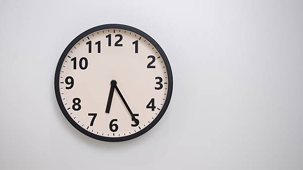 istock Classic Black-Edged Clock on White Background at 18.25 or 06.25 - Perfect for Time Management and Text Space 2174195835