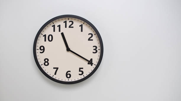 istock Classic Black-Edged Clock on White Background at 23.20 or 11.20 - Perfect for Time Management and Text Space 2174197752
