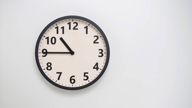 istock Classic Black-Edged Clock on White Background at 22.45 or 10.45 - Perfect for Time Management and Text Space 2174197756