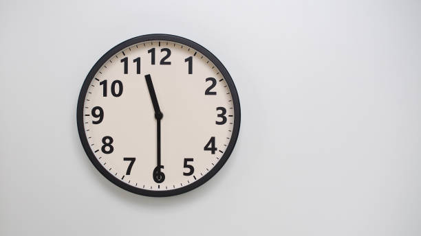 istock Classic Black-Edged Clock on White Background at 11.30/23.30 - Perfect for Time Management and Text Space 2174197770