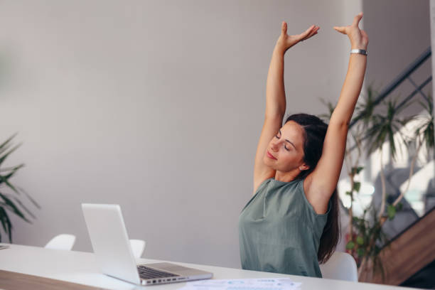 istock Relaxed Woman Enjoying A Peaceful Moment At Office 2174198008