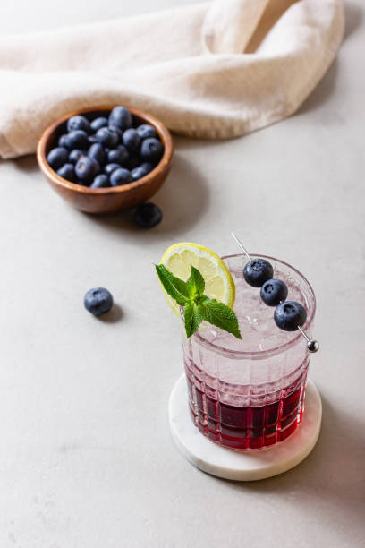 istock Cocktail with ice in a glass on marble 2174198213