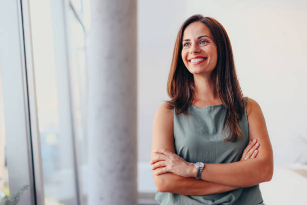 istock Smiling businesswoman in modern office. 2174198595