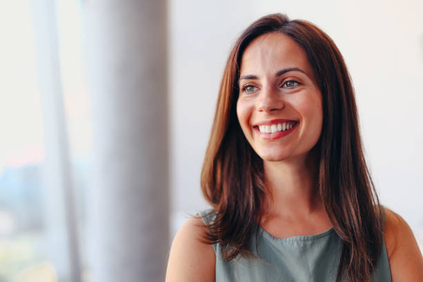 istock Smiling businesswoman posing in modern office 2174198842