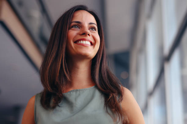istock Smiling businesswoman posing in modern office 2174198844