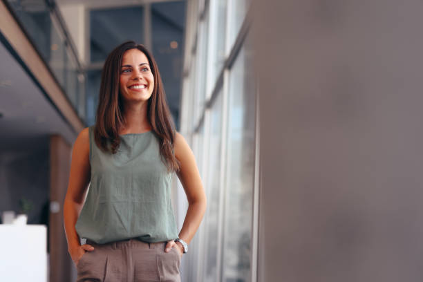 istock Smiling businesswoman in modern office. 2174198845