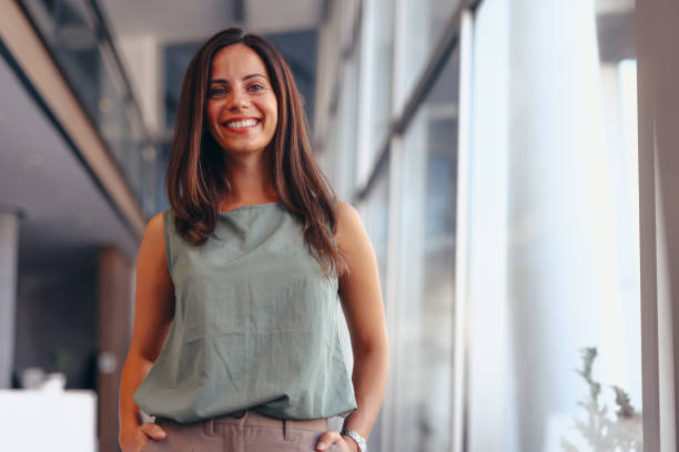 istock Smiling businesswoman in modern office. 2174198847