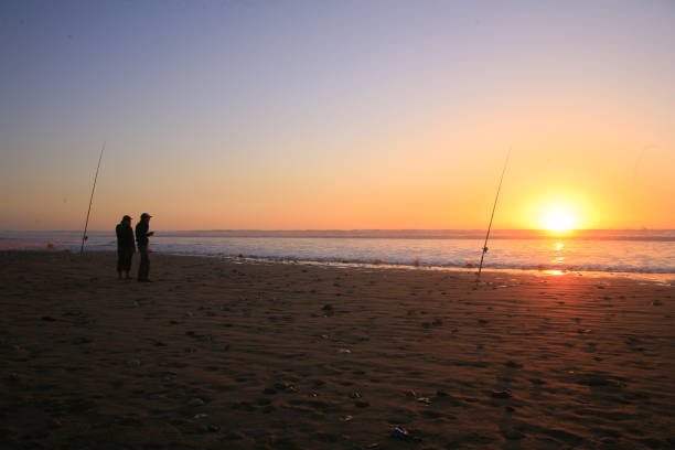 istock Beach fishing at sunset, low tide. 2174199092
