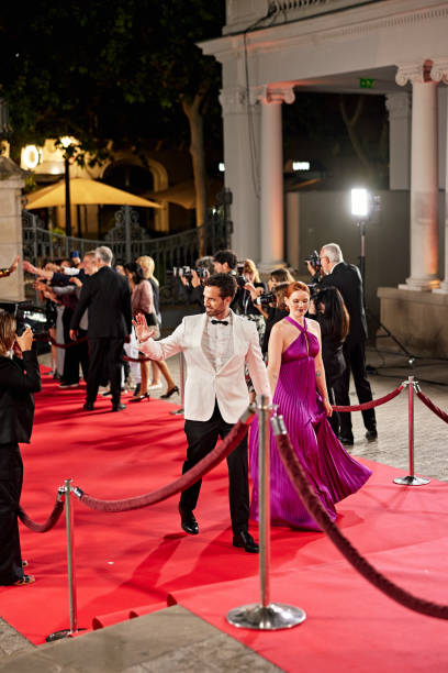 istock Elegant couple arriving at red carpet event 2174199115