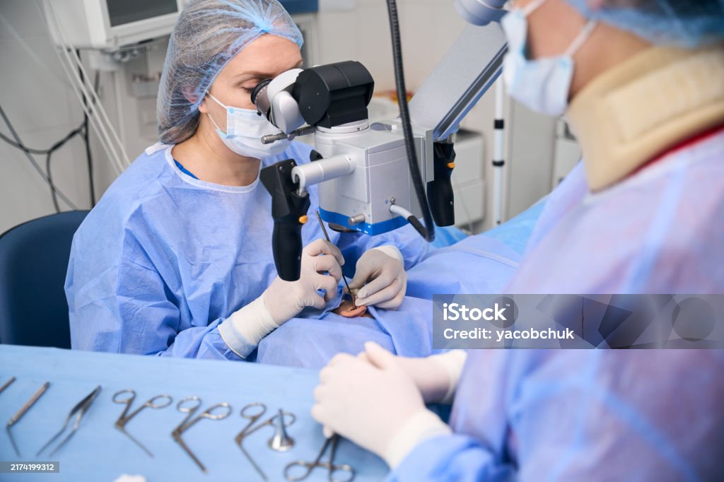 Loop Microscope Surgery Specialist Performs An Operation Using A Surgical Microscope Stock ...