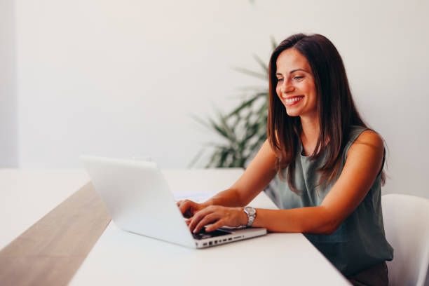 istock Successful businesswoman using laptop, working in office. Business technology corporate concept 2174199575