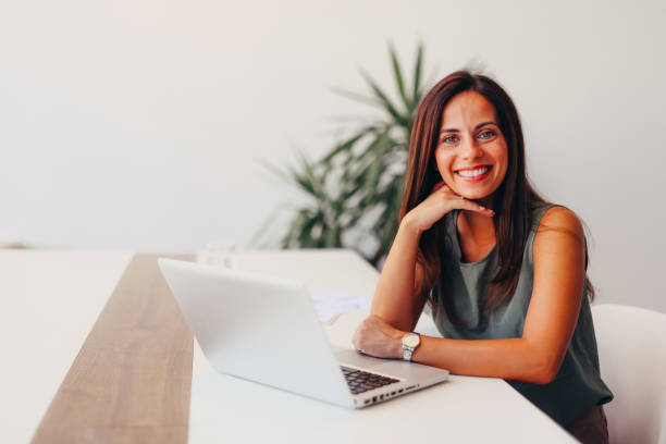 istock Successful businesswoman using laptop, working in office. Business technology corporate concept 2174199818
