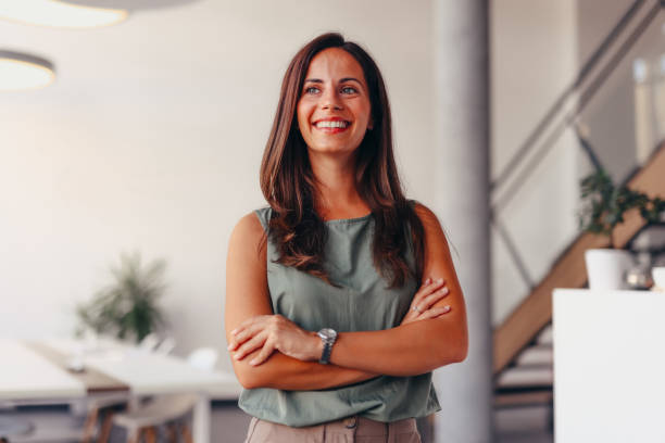 istock Smiling businesswoman posing in modern office 2174201591