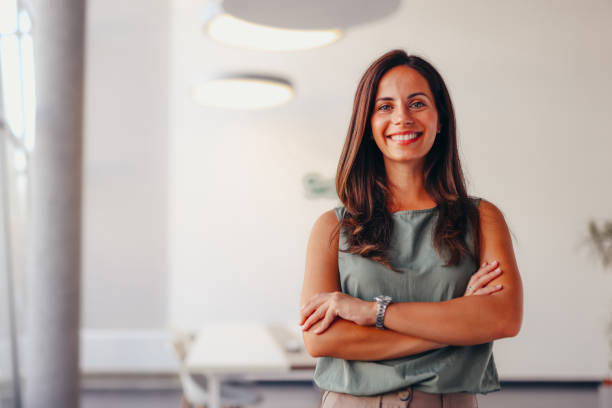 istock Smiling businesswoman posing in modern office 2174201594