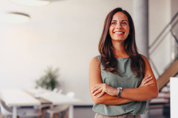 istock Smiling businesswoman posing in modern office 2174201895
