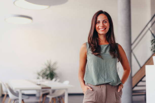 istock Smiling businesswoman posing in modern office 2174201909