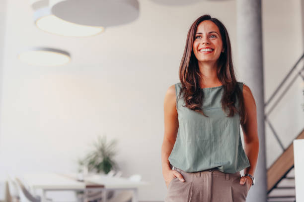 istock Smiling businesswoman posing in modern office 2174201910
