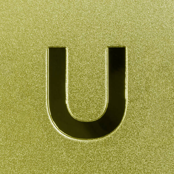 Letter U on a silver grained shiny metal surface. English alphabet. Element for design.