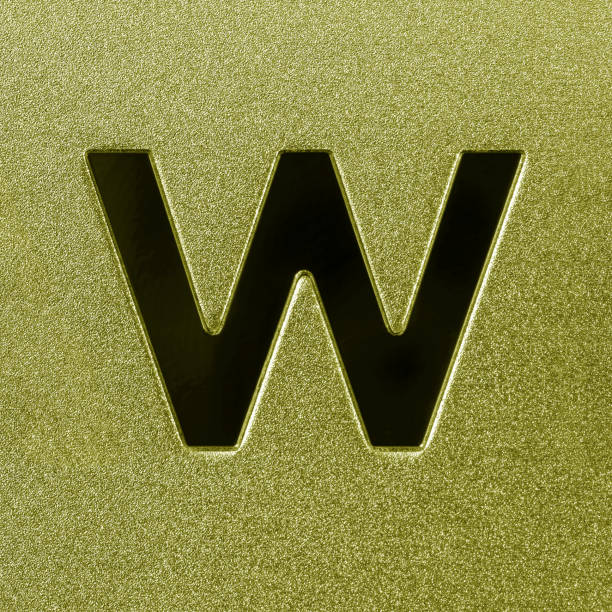 Letter W on a silver grained shiny metal surface. English alphabet. Element for design.